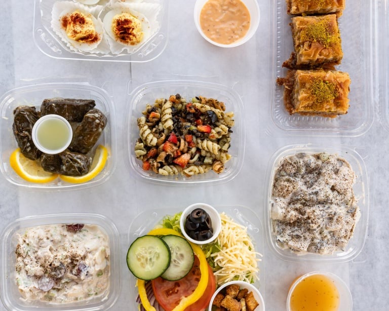Mediterranean meal prep with hummus and stuffed grape leaves